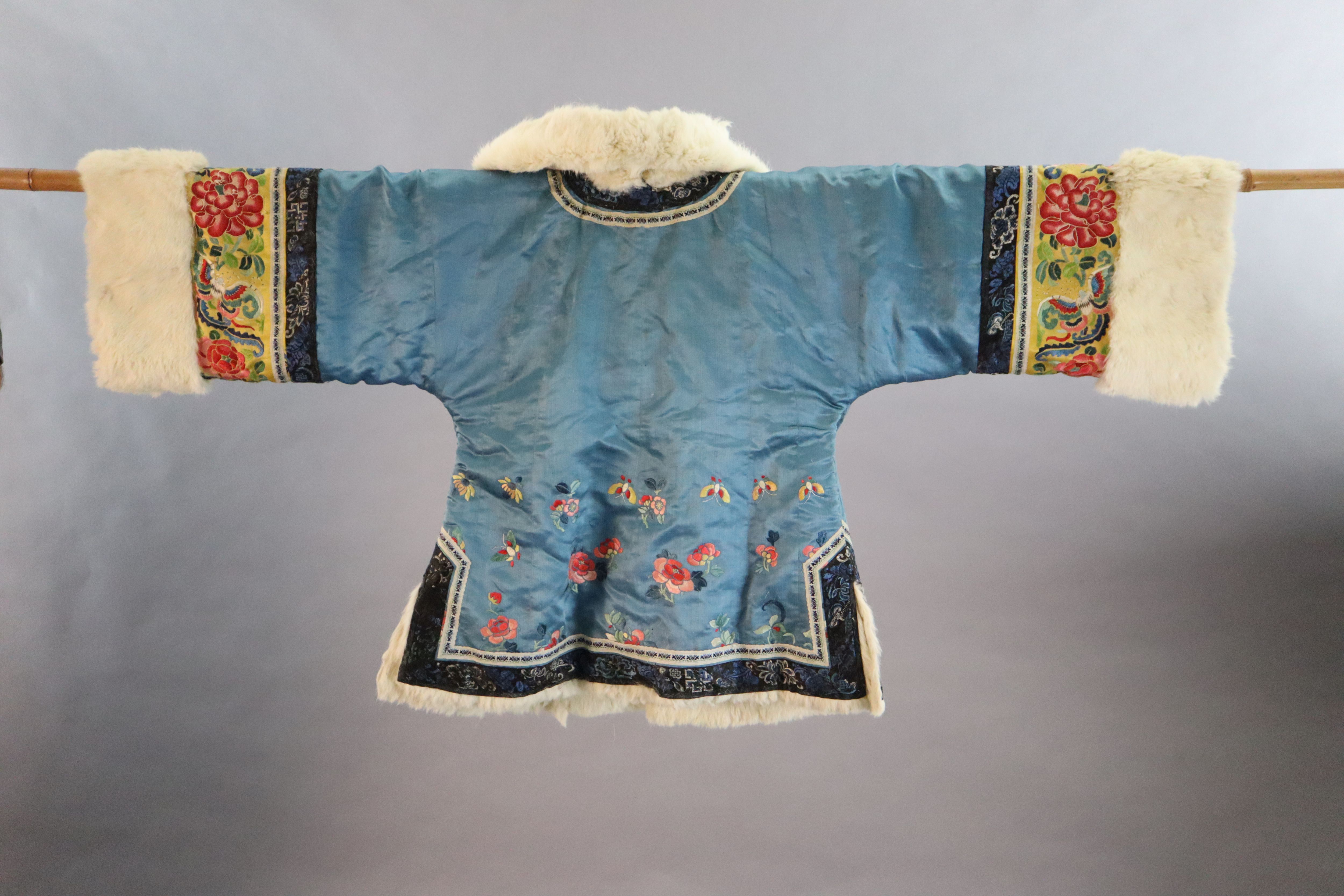 A Chinese embroidered silk winter jacket, late 19th/early 20th century, length 70cm